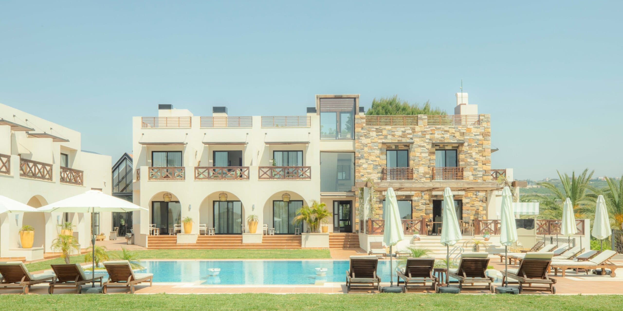 Hillside resort with swimming pools and green landscape overlooking the coastal city of Tyre in South Lebanon